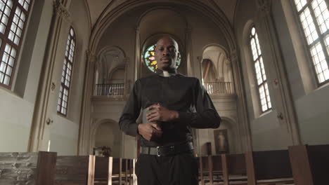 portrait of african-american priest in church