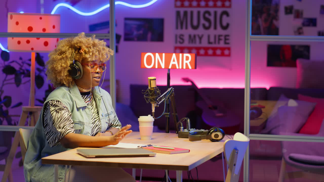 Woman hosting a podcast in a music studio