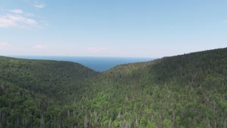 Beautiful-green-mountain-landscape---Saint-Anne-Des-Mont-Quebec---Aerial