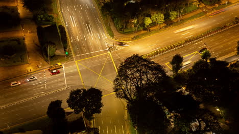 SINGAPORE - 3 MARCH 2025 : timelapse of the singapore city skyline and traffic on the roads at night
