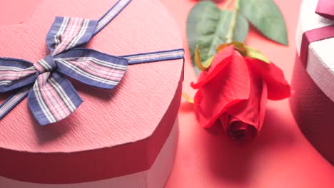 heart-shaped gift box with red rose