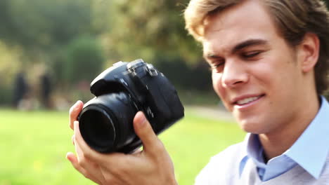 happy photographer taking photographs outdoors