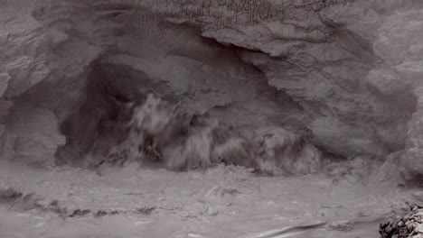 close-up of geothermal mud pot water boiling and splashing