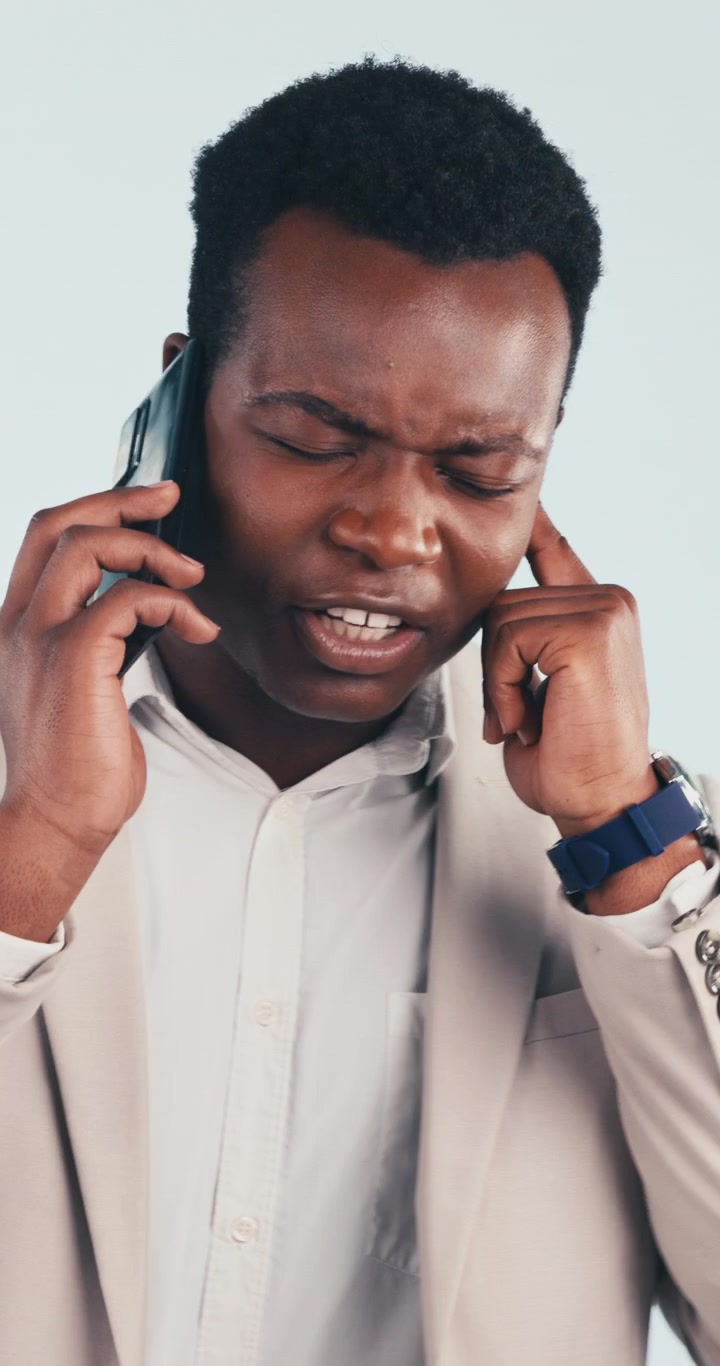 Stressed Businessman Having a Difficult Phone Conversation