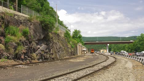 A-View-of-an-Electric-Diesel-Passenger-Train-Approaching-on-a-Head-on-View-on-a-Sunny-Summer-Day