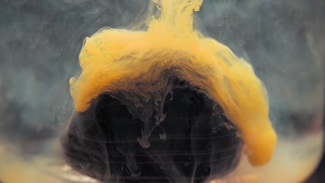 slowmotion paint floating inside water tank, beautiful layered rock. stable shot with the sony a7iii.