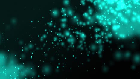 partículas azules brillantes flotando hacia arriba sobre un fondo oscuro