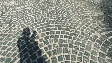 shadows cast on cobblestone street in naples