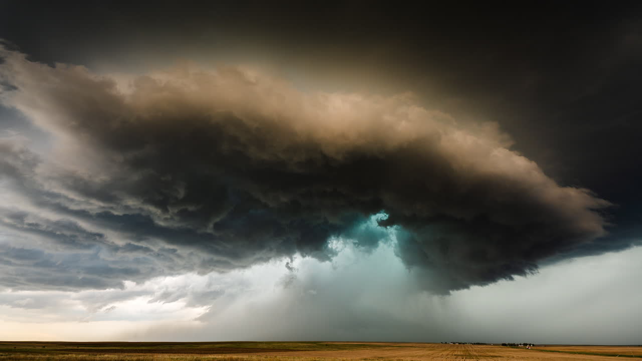 Powerful supercell thunderstorm clouds bring severe weather and flooding