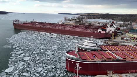 large great lakes freighters arrive at the fincantieri bay ship yard in sturgeon bay, wisconsin for service and maintenance during the winter months.