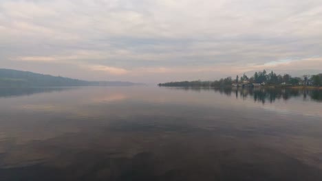 misty scene over lake windermere in the english lake district national park