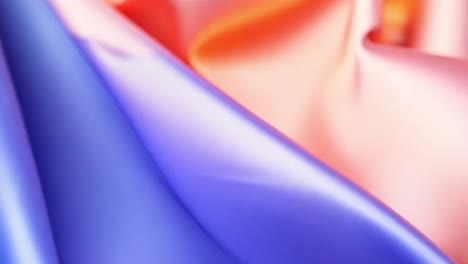 close-up of flowing silk fabric with vibrant color gradients