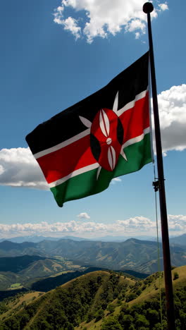 kenyan flag waving over mountain scenery