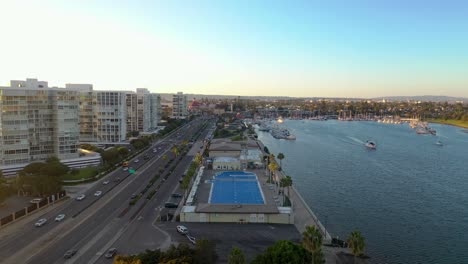 Forward-Slider-Aerial-shot-over-Coronado-Community-Center-in-San-Diego,-California-During-Golden-Hour