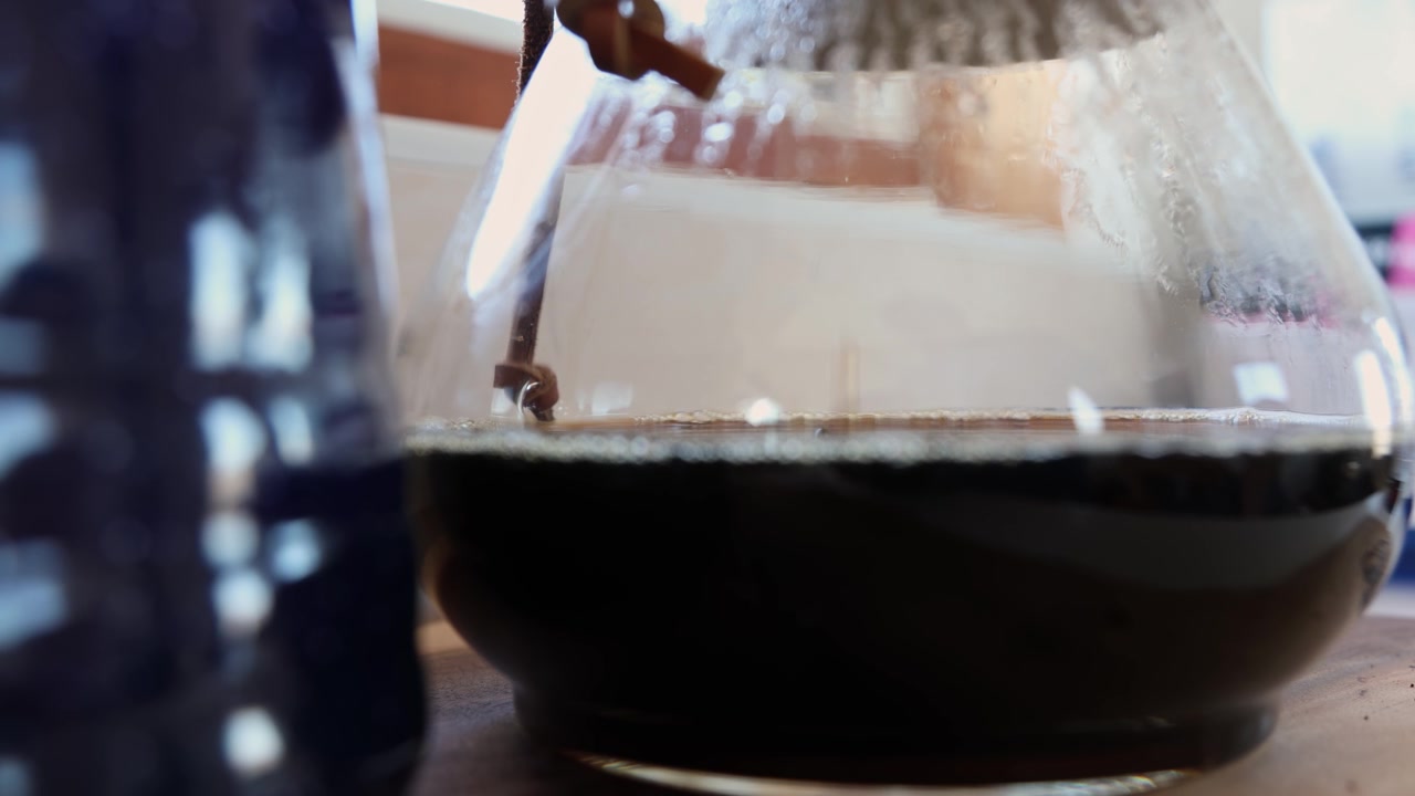 Brewed Black Coffee In Glass Pot - Close Up