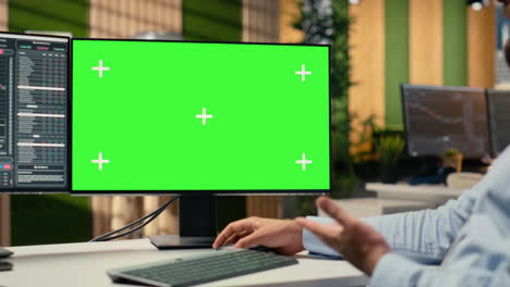 close up of investment consultant using green screen pc