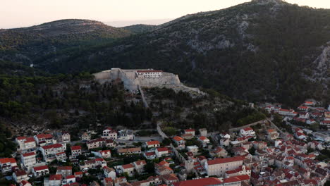 scenic view of town of hvar and fortica fortress, dalmatia archipelago of croatia - aerial drone shot