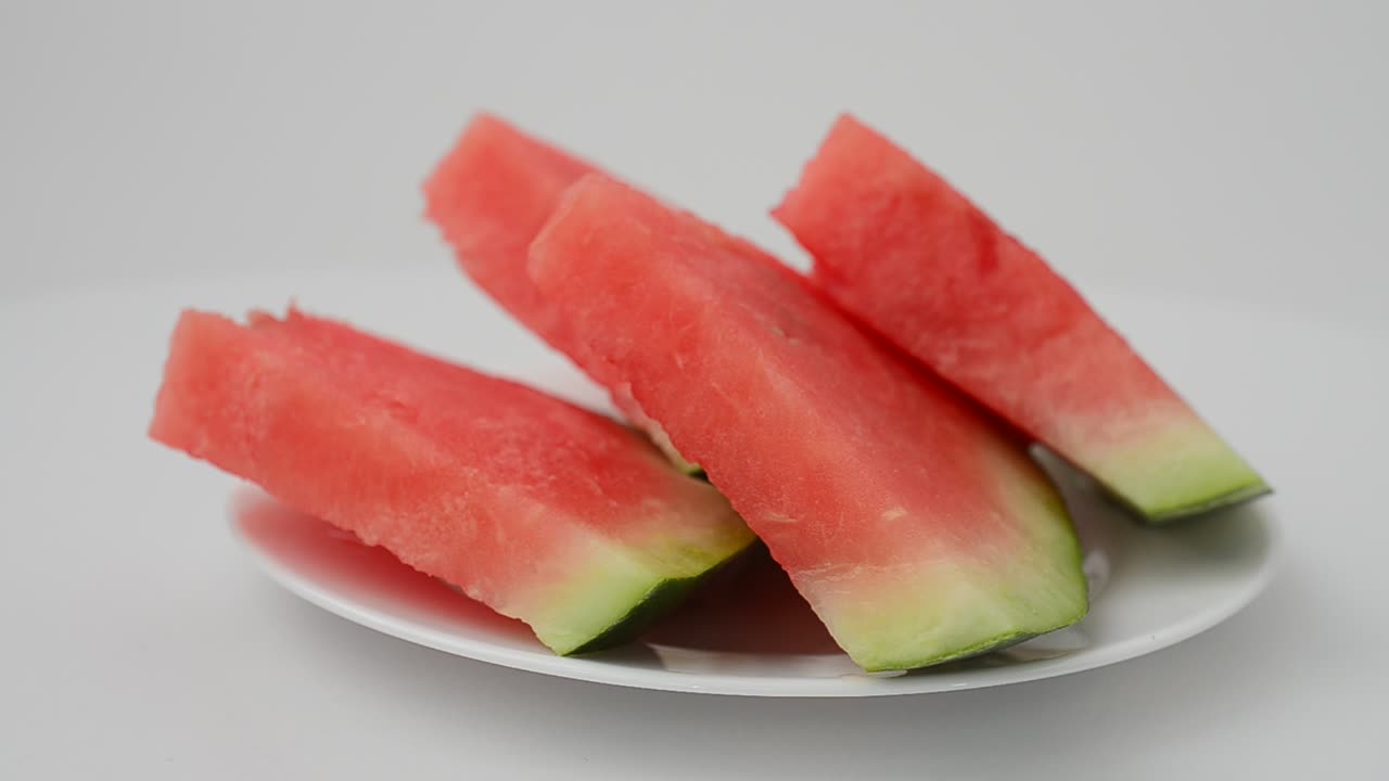 Shooting of pieces of a watermelon. Shooting in the movement