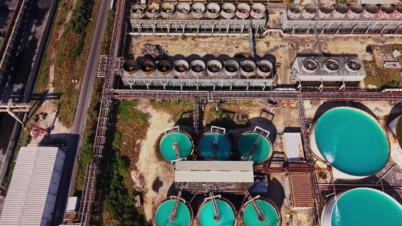 Water treatment facility showing large tanks and pipes