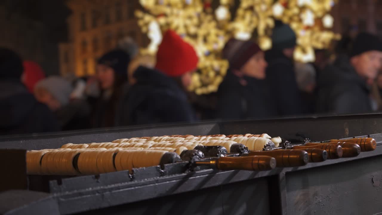 Trdelnik and people in Christmas Prague, traditional street food of Czech Republic