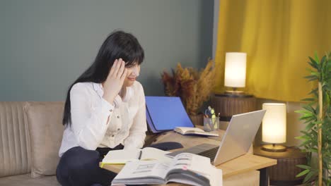 a male student gets upset when she sees bad exam results on the laptop.