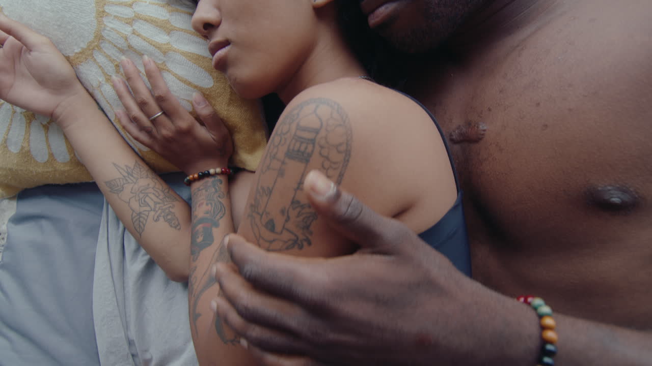 Young Couple Sleeping Together and Hugging