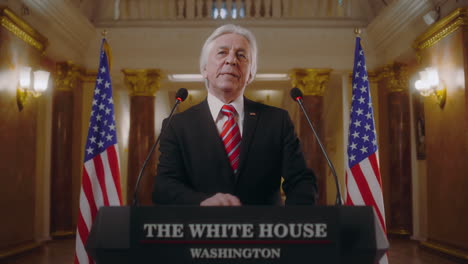 inspired president of the united states pronounces political speech during press conference, journalists applaud. elderly american minister speaks with media journalists in white house. slow motion.