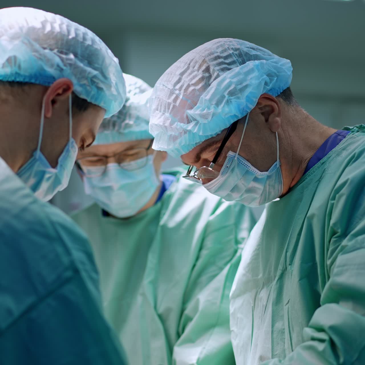 Modern operating teamwork. Surgery specialists working in sterile emergency room