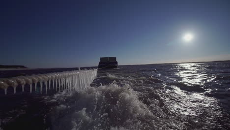 boat on a frozen river in winter