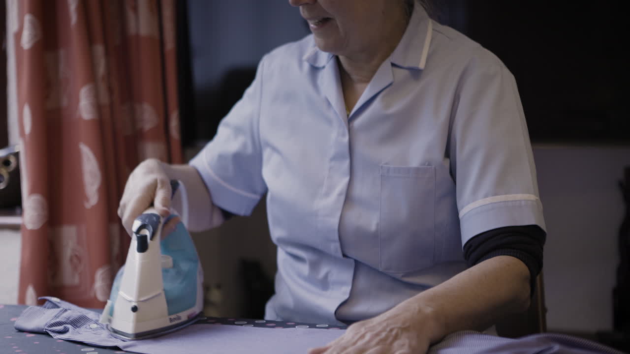 Woman Ironing Laundry