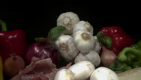 a slider shot over a collection of italian vegetables, salami and cheese