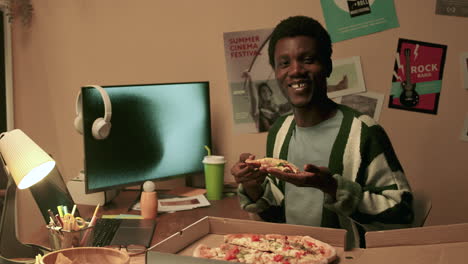 man eating delicious pizza