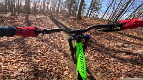 mtb pov rider in action packed trail twisty turns and cool jumps sunny autumn day