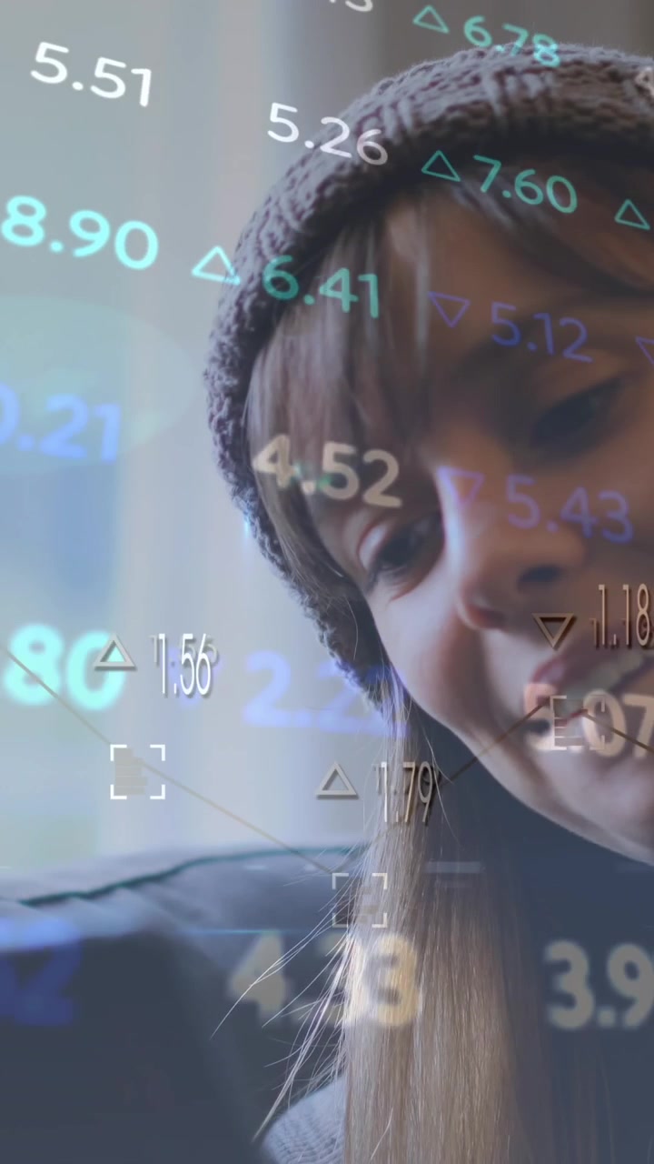 Animation of multicolored trading board over smiling caucasian woman chatting using cellphone