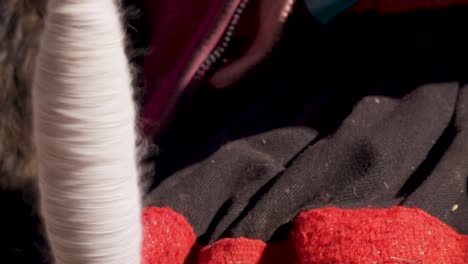 peruvian woman in andes mountains spinning yarn on drop spindle 4