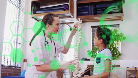 animation of medical data processing over diverse female doctor and boy patient discussing spine