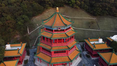 drone pan of a red temple in hong kong