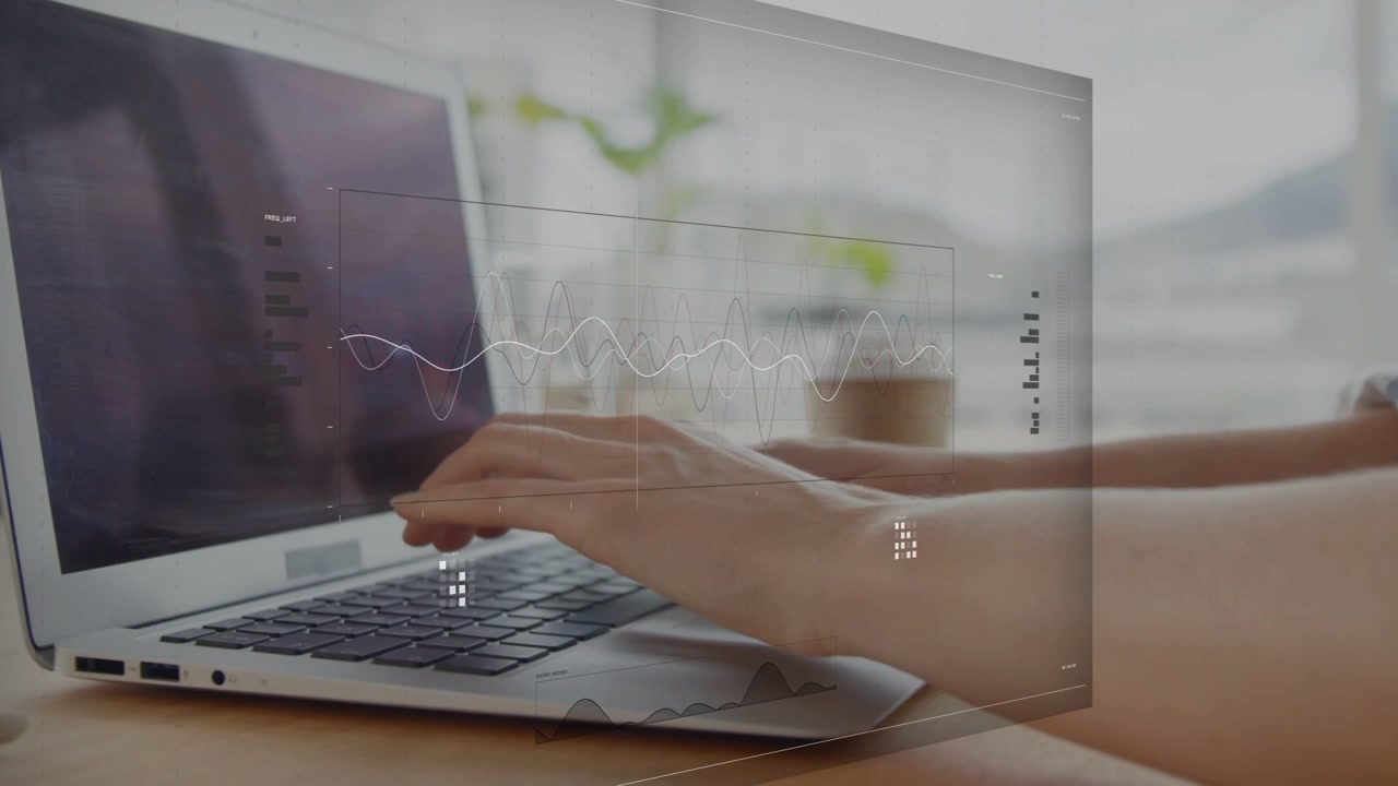 Woman resting then typing at desk, fingers lifting animating data overlays analyzing metrics