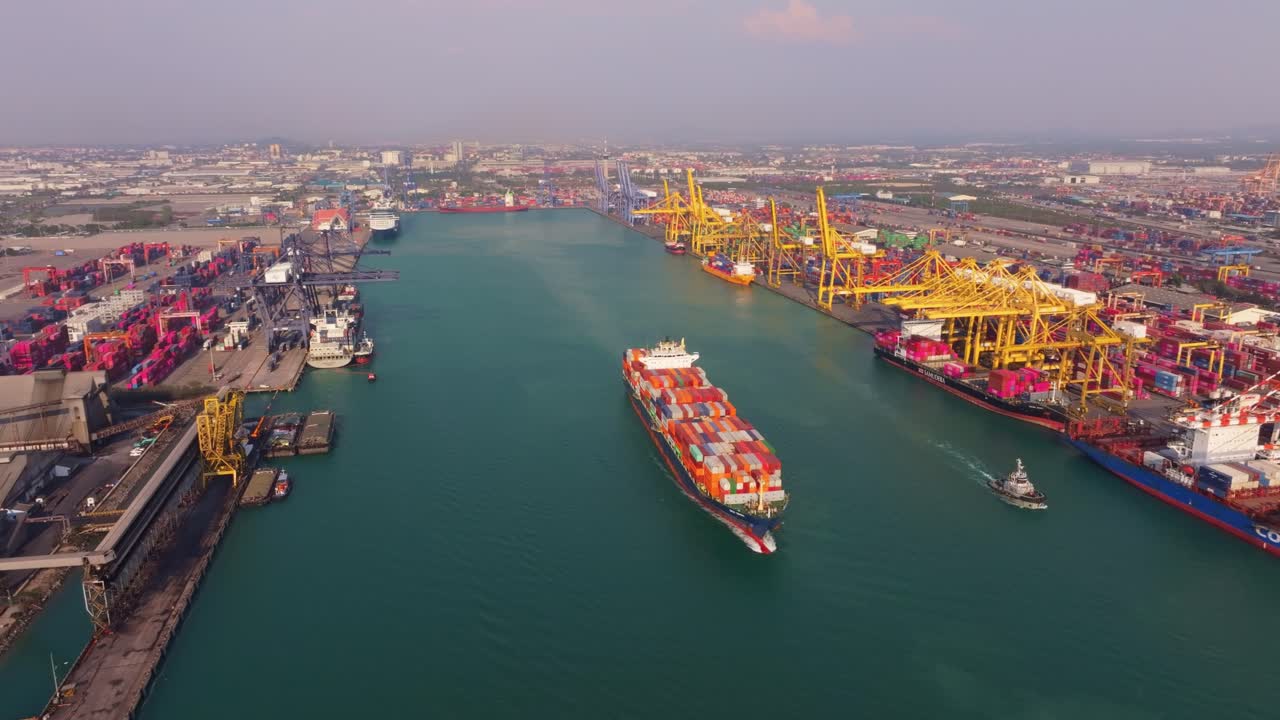 Freight ship sailing away from harbor, Thailand