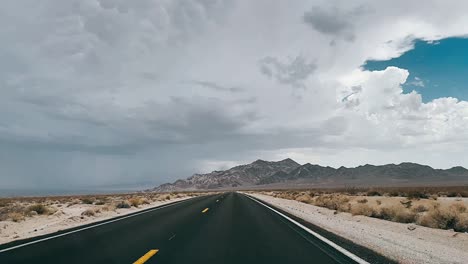 desert highway under stormy sky