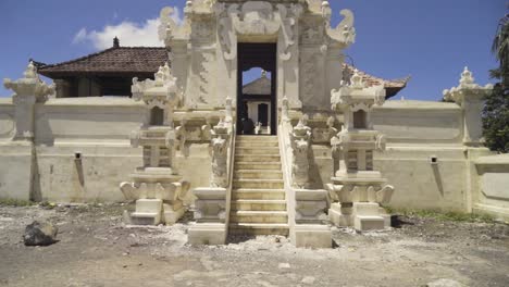 tilt up shot of an ancient gate at a buddhist temple