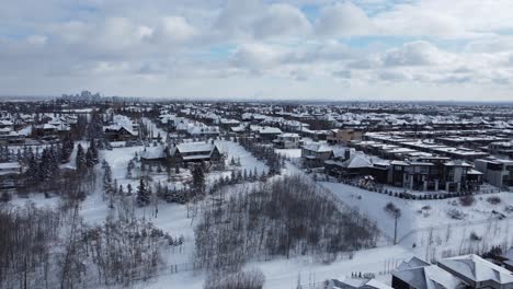 Aerial-view-of-a-suburban-community-in-Calgary,-Alberta-in-winter