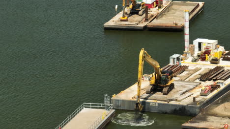 excavator at work on mississippi river near us lock and dam no