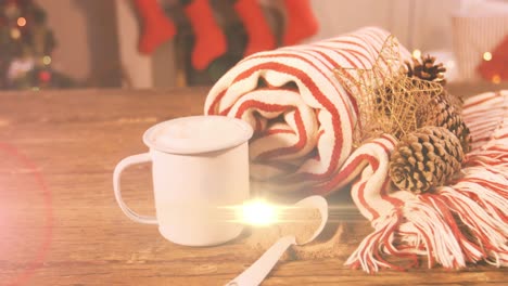 Animation-of-light-moving-over-christmas-decoration-and-mug