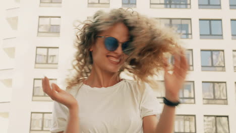 woman with curly hair in the city