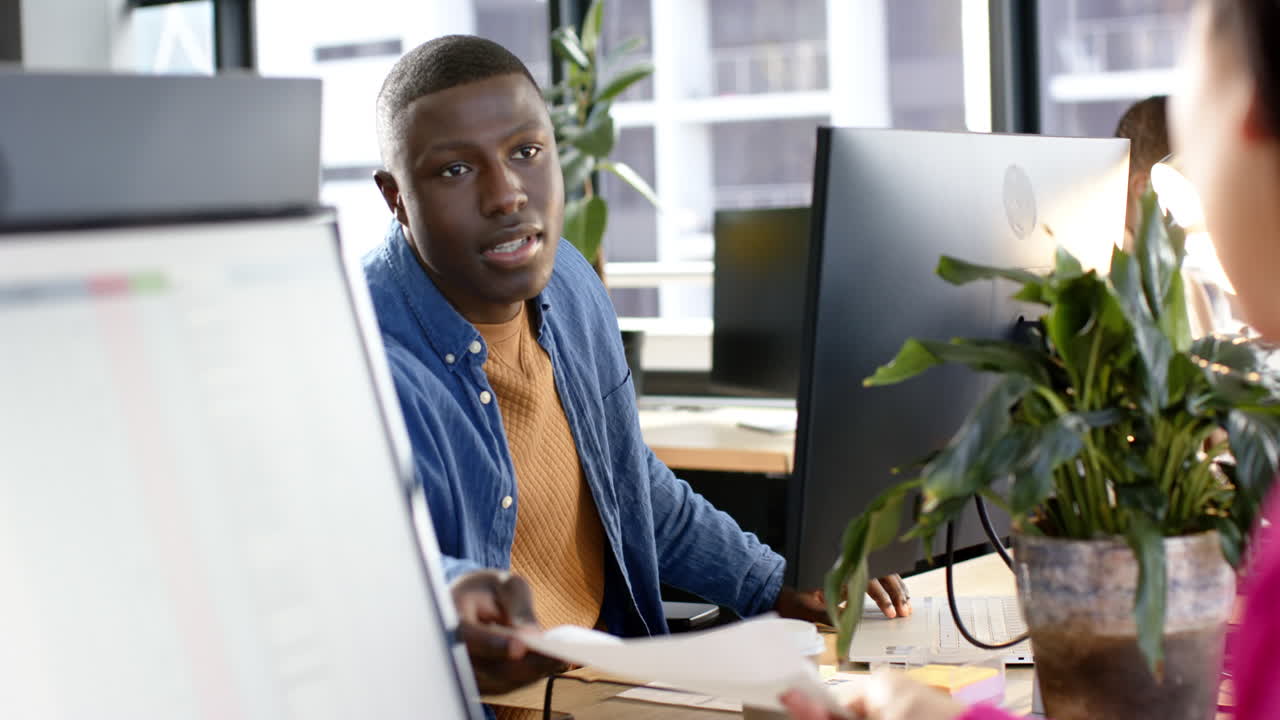 African american businessman using computer in office, slow motion, copy space