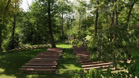 aerial, empty outdoor forest wedding ceremony venue during the day with no one