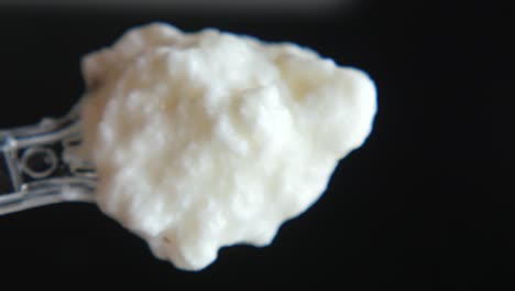 close-up of creamy kefir on a spoon