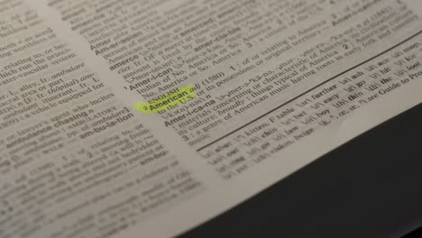 american dictionary highlighter concept, highlighting a word in a dictionary to show it's definition