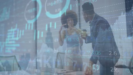 animation of financial data and graphs over diverse coworkers in office
